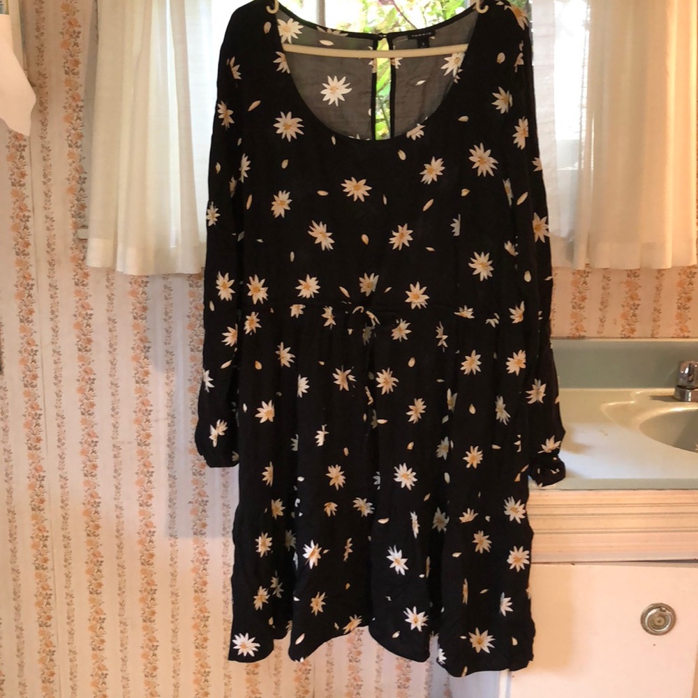 Black knee length dress with daisy print